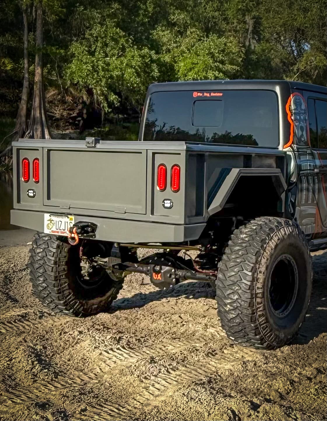 War Dog M1 bobbed bed on a lifted Jeep Gladiator flexing on the trail